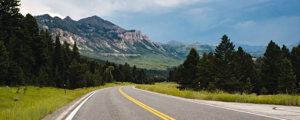 winding road leading towards mountains